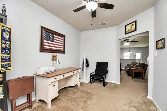 office with ceiling fan and light colored carpet