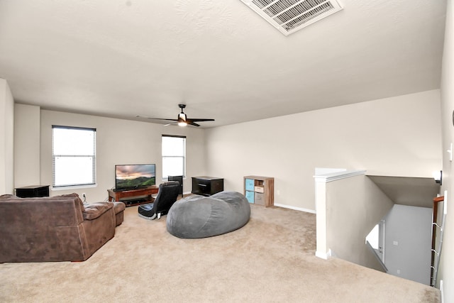 living room featuring ceiling fan and carpet flooring