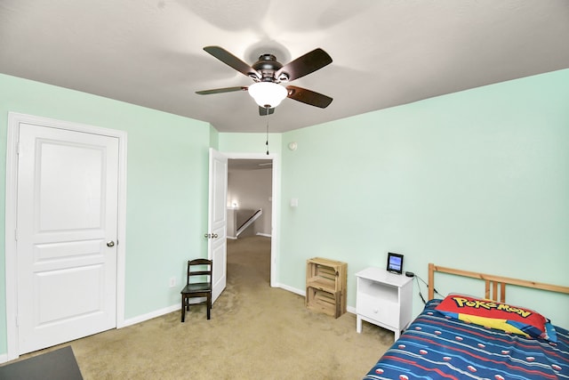 bedroom with light carpet and ceiling fan