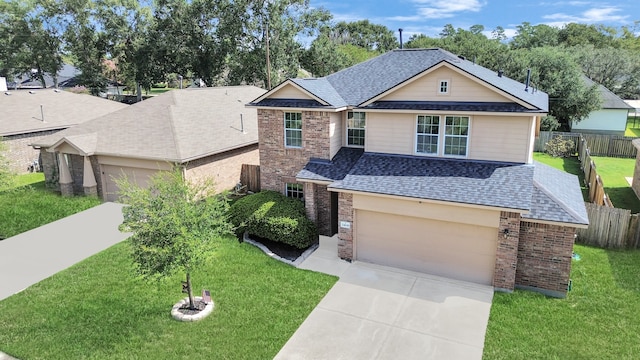 view of front of property featuring a garage and a front yard