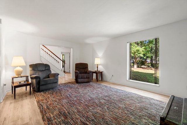 6711 River Lodge Dr, Spring, TX 77379 - living area featuring baseboards, stairs, and wood finished floors