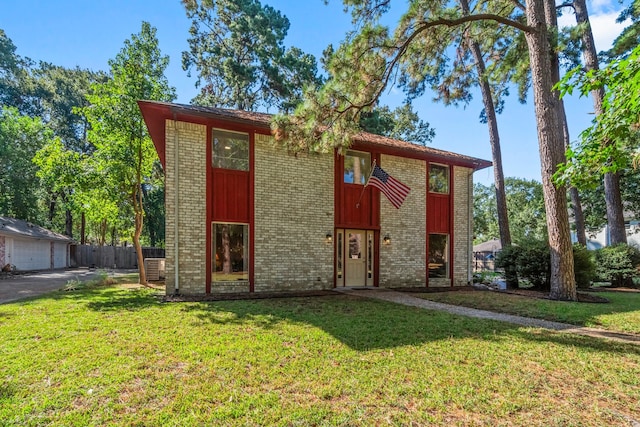 view of outbuilding featuring a garage and a lawn