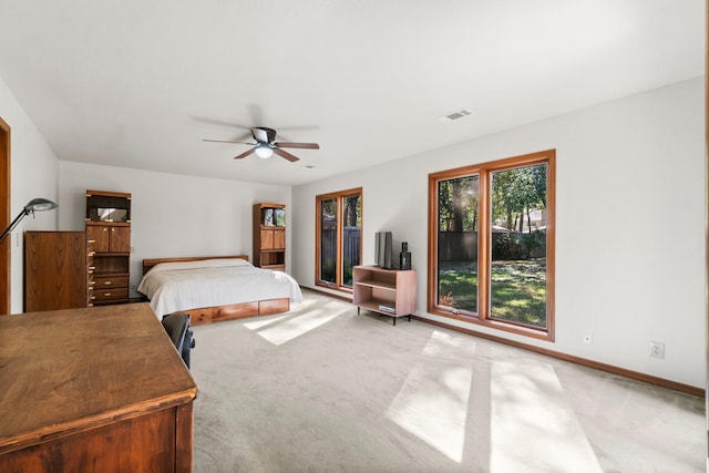 6711 River Lodge Dr, Spring, TX 77379 - carpeted bedroom with baseboards, visible vents, and ceiling fan