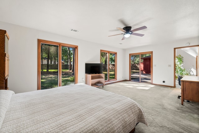 bedroom featuring access to exterior, light colored carpet, and ceiling fan