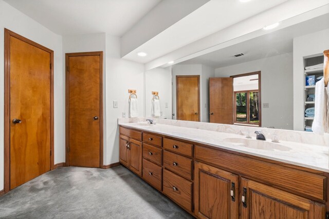 6711 River Lodge Dr, Spring, TX 77379 - bathroom featuring double vanity, visible vents, a sink, and recessed lighting