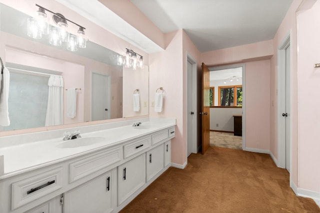 6711 River Lodge Dr, Spring, TX 77379 - full bath featuring carpet flooring, double vanity, baseboards, and a sink