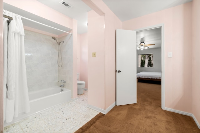 bathroom with shower / tub combo, toilet, and ceiling fan