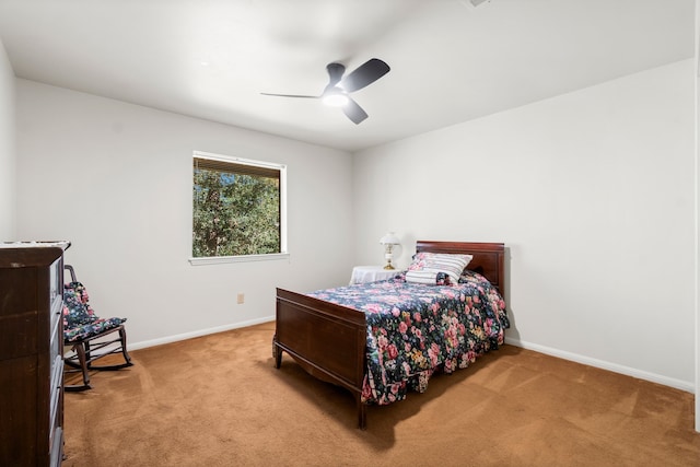 bedroom featuring light carpet and ceiling fan