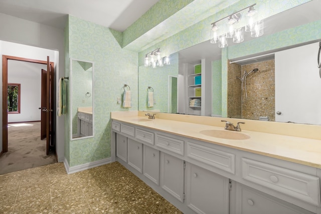 bathroom featuring vanity and a tile shower