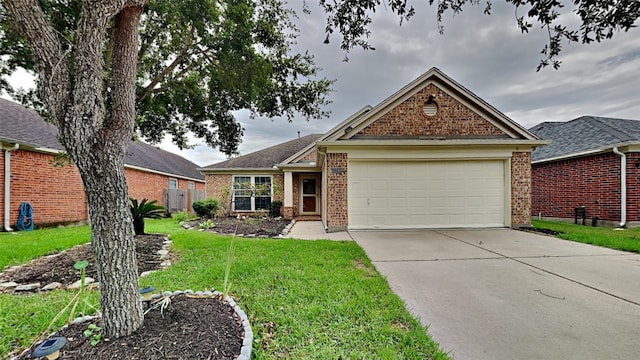 view of front of property featuring a front yard and a garage