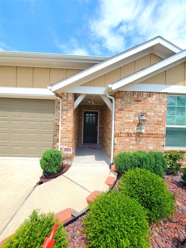 view of exterior entry featuring a garage