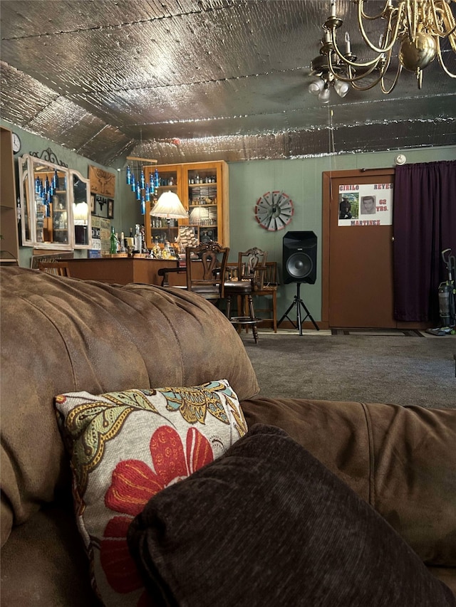 bedroom with carpet floors and a chandelier