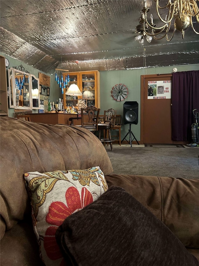 208 S Karnes Ave, Cameron, TX 76520 - carpeted living area featuring a chandelier and lofted ceiling