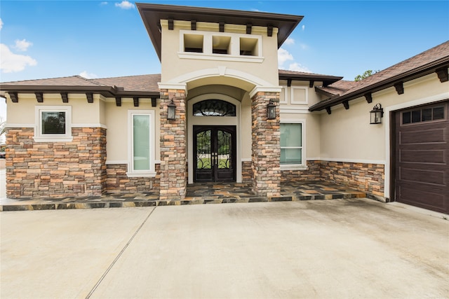 doorway to property featuring a garage