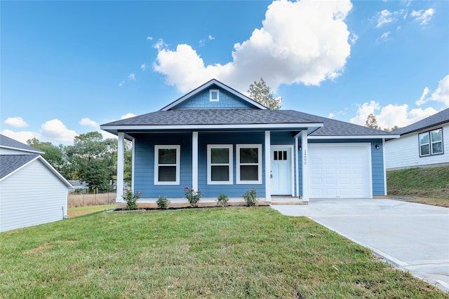 view of front of house with a front lawn, a porch, and a garage