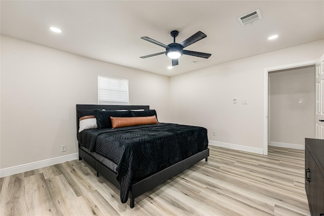 bedroom with ceiling fan and light wood-type flooring