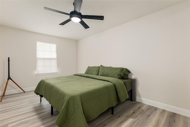 bedroom featuring ceiling fan and light wood-type flooring