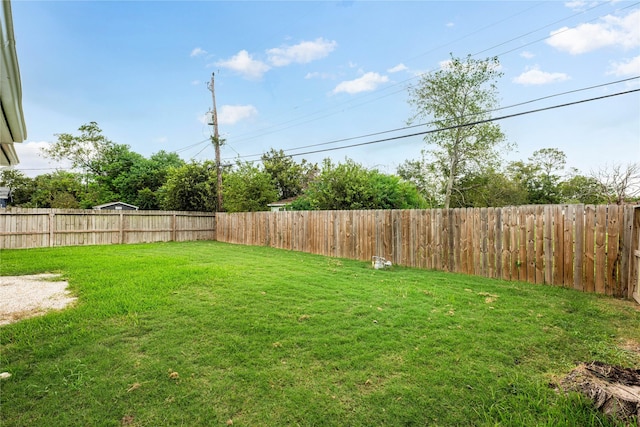 view of yard with a fenced backyard