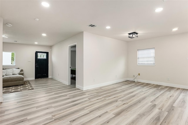 entryway with light wood-style flooring, visible vents, baseboards, and recessed lighting