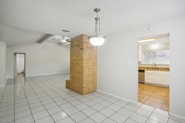 tiled spare room with ceiling fan, vaulted ceiling with beams, a textured ceiling, and sink