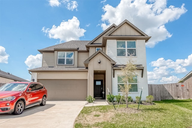 view of front facade featuring a garage and a front lawn