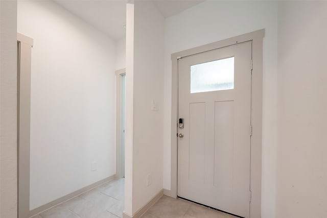 entrance foyer with light tile patterned flooring