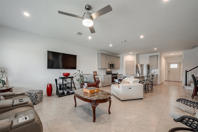 living room featuring ceiling fan and light tile patterned flooring