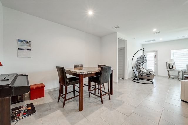 dining room featuring light tile patterned floors