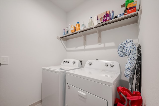 laundry room with separate washer and dryer