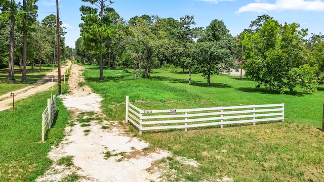 exterior space with a rural view and a yard