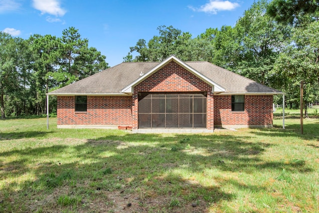 ranch-style house featuring a front lawn