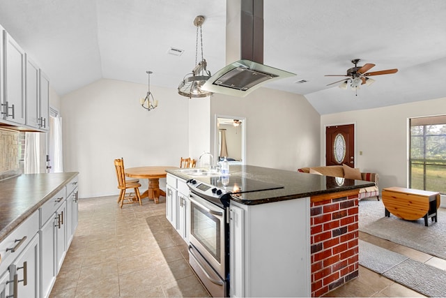 kitchen with white cabinetry, stainless steel electric range, island range hood, lofted ceiling, and a kitchen island with sink