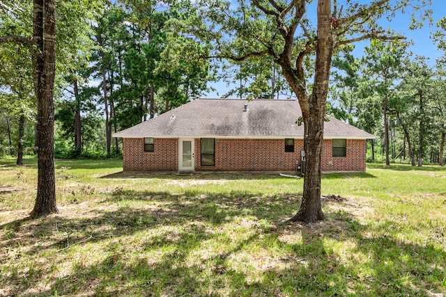 view of property exterior with a yard