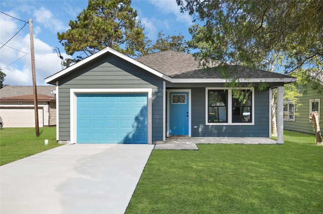 view of front facade with a front lawn and a garage