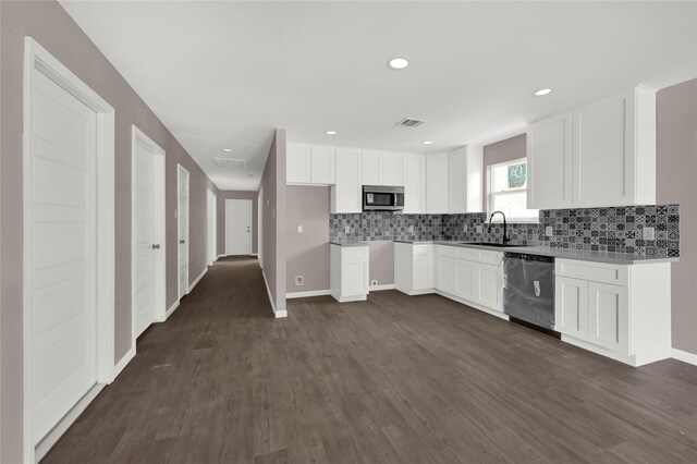 kitchen featuring white cabinetry, stainless steel appliances, dark hardwood / wood-style flooring, and sink