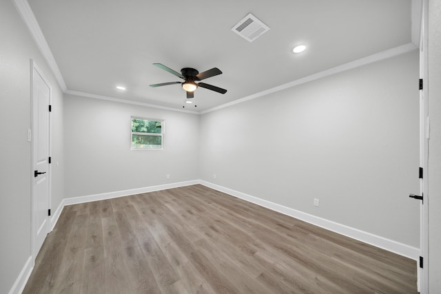 spare room featuring ceiling fan, light hardwood / wood-style floors, and ornamental molding