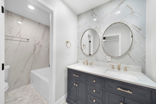 full bathroom featuring plus walk in shower, tile walls, vanity, and toilet