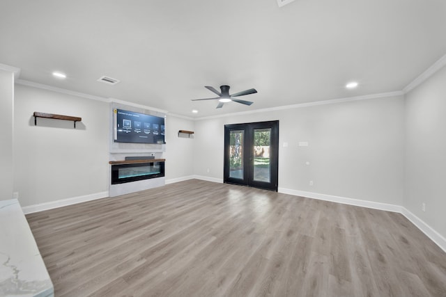 unfurnished living room with light wood-type flooring, crown molding, and ceiling fan