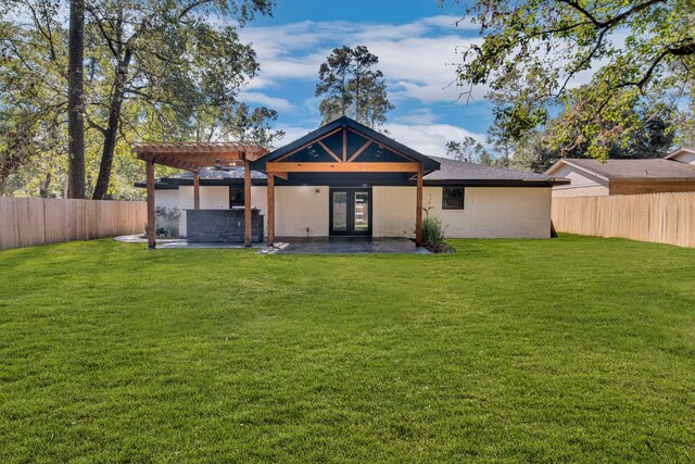 exterior space with a front yard, french doors, a pergola, and a patio