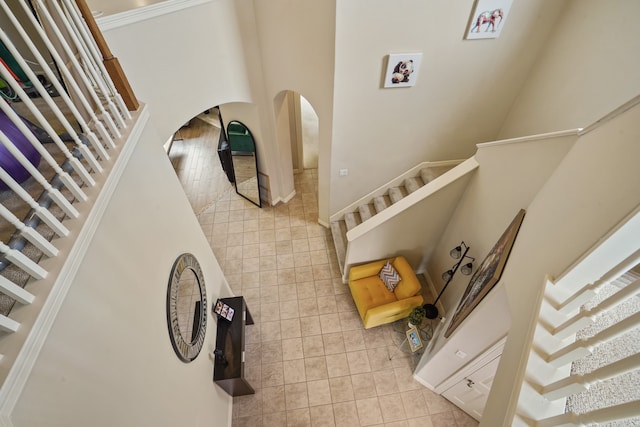 stairway with tile patterned floors