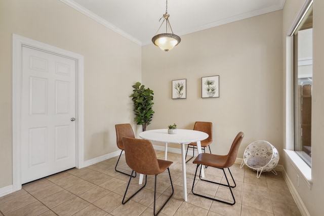 tiled dining space featuring crown molding