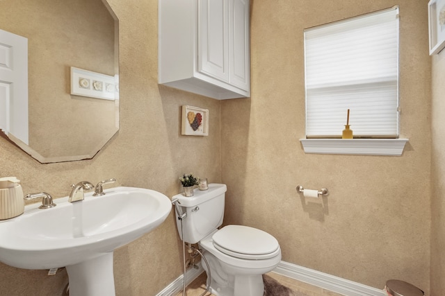 bathroom with toilet and sink