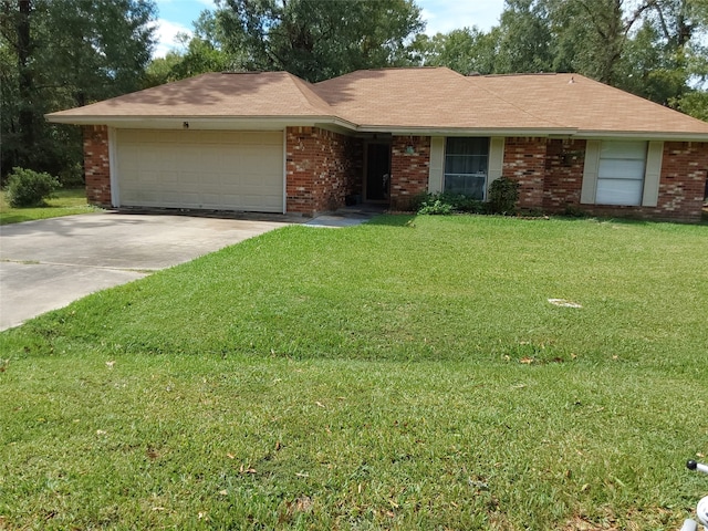 ranch-style home with a front yard and a garage