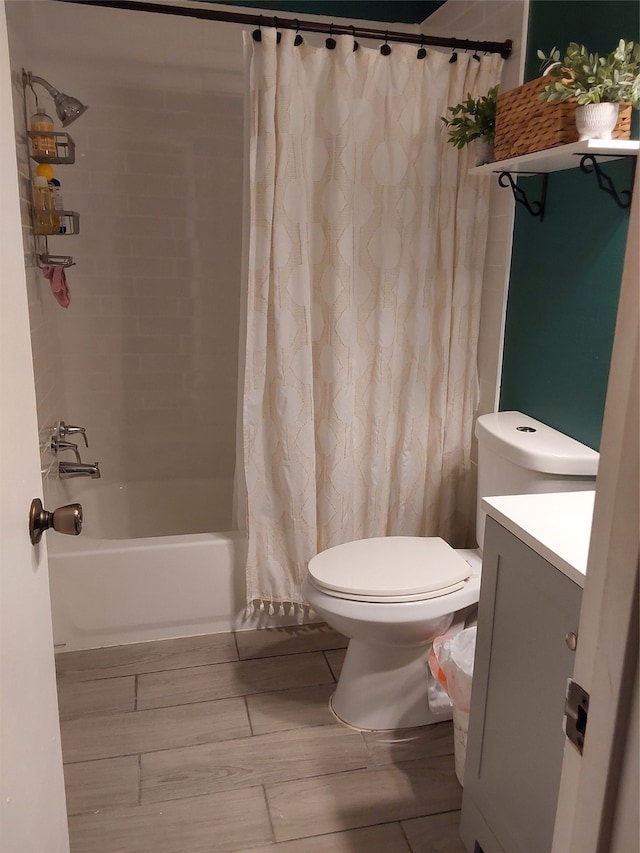 full bathroom featuring vanity, toilet, and shower / bath combination with curtain