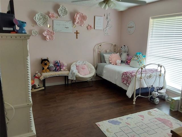 bedroom with ceiling fan and dark wood-type flooring