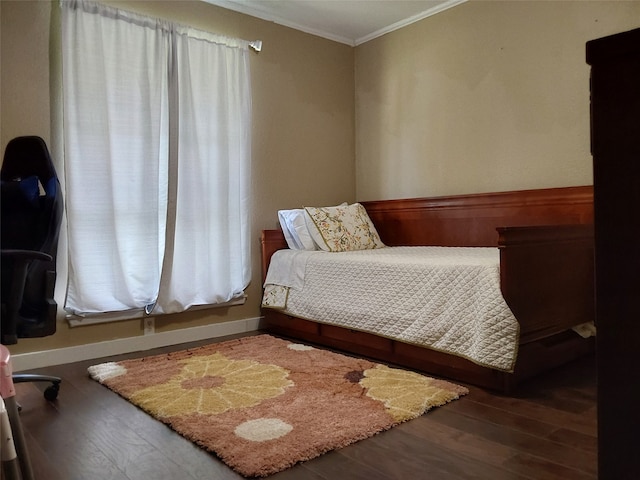 bedroom with wood-type flooring and crown molding