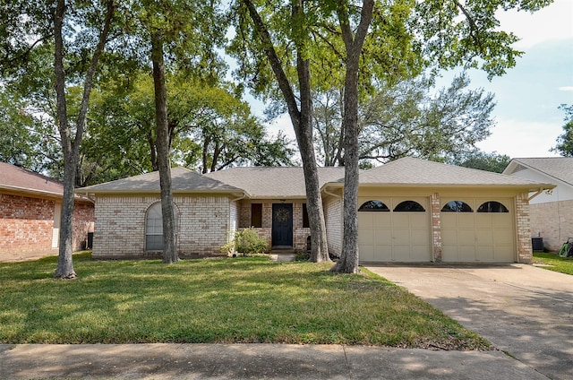 ranch-style house with a front yard and a garage