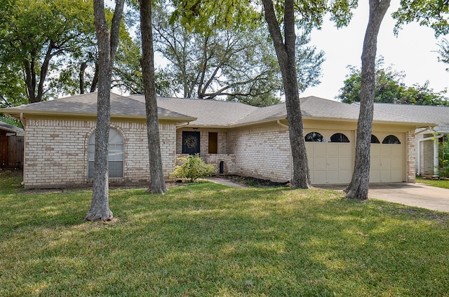 single story home with a garage and a front lawn