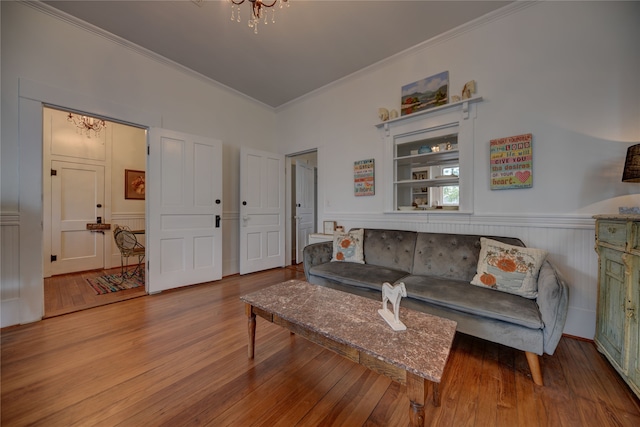 living room featuring ornamental molding and light hardwood / wood-style floors