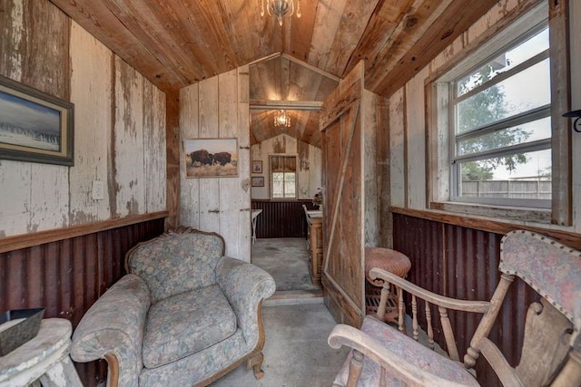 living area featuring wood ceiling, lofted ceiling, wood walls, and concrete flooring